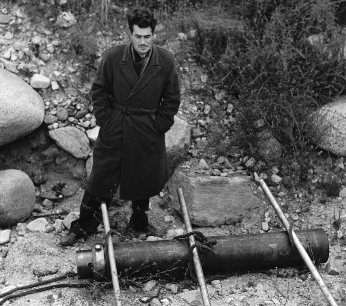 Jack Parsons stands in a quarry where early rocket experiments were executed