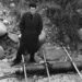 Jack Parsons stands in a quarry where early rocket experiments were executed